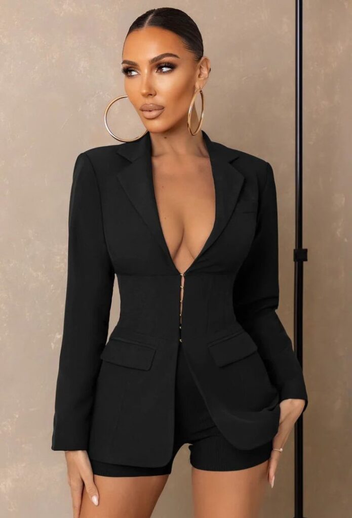 A woman wearing a black blazer