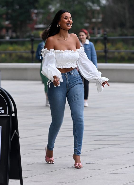 a woman wearing Crop Top and Jeans